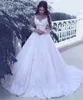 Vestidos de novia árabes de manga larga Bateau vintage Apliques de escote transparente Vestidos de novia de encaje Tren de barrido de tul Vestido de novia de princesa