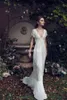 Vintage Sheath Wedding Dresses Lihi Hod Lace Bohemian Deep V neck Backless Boho Bridal Gowns 2019 Floor Length Short Sleeves Custom