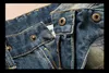 Moda nowe męskie dżinsy fajne męskie postrzępione porwane dżinsy projektant mody proste motocyklowe dżinsy dla motocyklistów przyczynowe spodnie dżinsowe styl streetwear