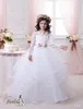 2021 Ballkleid-Blumenmädchenkleider mit langen Ärmeln und Stufenrock, Spitzenapplikationen aus Tüll, wunderschöne Erstkommunionkleider für kleine Mädchen