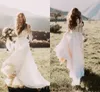2020 Vestidos de novia de campo bohemios baratos Mangas largas transparentes Cuello de joya Una línea Apliques de encaje Gasa Boho Tallas grandes Vestidos de novia formales