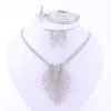 Parure di gioielli per le donne Accessori placcati in oro/argento Ciondolo Dichiarazione Perline africane Collana di cristallo Orecchini Bracciale Anello