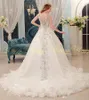 Abito da sposa di cristallo di lusso 2023 Tulle con perline di pizzo A-line Foto reale Ruffle Lungo treno da cattedrale Abiti da sposa sexy senza schienale Bling