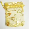 100 stks gouden hart organza pakbakken sieraden zakjes bruiloft gunsten kerstfeest cadeauzakje 7 x 9 cm (2,75 x 3,5 inch)