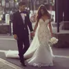 Gorgeous Steven Khalil Dubai Style Bröllopsklänningar från axel Arabiska Full Length Backless Lace Bridal Gowns Mermaid