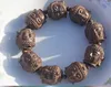 Hand-carved - small leaf rosewood Buddha head (Tibetan Buddhism) rosary, string of rubber strings, charm beaded bracelet