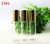 Wholesale 1200pcs Refillable Thick 5ml 1/6oz MINI ROLL ON Clear GLASS BOTTLES ESSENTIAL OIL Steel Metal Roller ball with Gold Cap