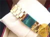 Högkvalitativt mode guldklocka Nyankomst Clover Quartz Sport Relojes Dam Herrklänning Guld Cartoon Armbandsur