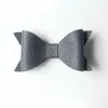 Ny imitation läder stora storlekar bågar design baby hårnålar handgjorda aritificiella filt barn hårklipp härliga bowknot hår tillbehör