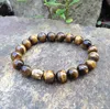 SN0386 Diseñador 10 mm pulsera de Buda de ojo de tigre pulseras de hombre de cuentas de piedra natural pulsera de cabeza de Buda de plata