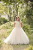 2022 Lace Modest Bröllopsklänning med Illusion Scoop Neckline Cap Sleeves Beaded Pearls Tulle A-Line Bröllopsklänningar Plus Size Vestidos de Novia