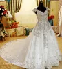 Luxury Crystal Beaded Bröllopsklänningar Romantiskt En Linje Cap Sleeve Tulle Lace Applique Långa Kvinnor Bröllop Party Gowns