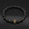 Venta al por mayor de pulseras con cuentas de cabeza de león, joyería, pulsera de piedra de Lava negra para hombres y mujeres