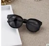 Varumärkesdesigner barn runda barnflickor solglasögon anti-uv reflekterande spegel godis färg mode solglasögon oculos