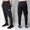 Pantalones al por mayor High Street moda cremallera para hombre joggers pantalones biker pantalones de chándal frescos mujeres y hombres pantalones hip hop medias para hombre baile callejero