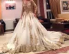 Vestidos de noche de dos piezas de estilo saudita mangas largas vestidos de noche de ilusión sexy apliques de abalorios de oro vestidos de novia 2016