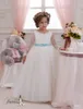 2016 أطفال فساتين التخرج مع طويلة الأكمام والقوس شاح مطرز تول ballgown زهرة بنات أثواب مخصص