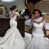 Stunning Luxury Långärmad Hög Neck Bröllopsklänningar Kristaller Beaded Lace Appliques Illusion Back African Bridal Gowns