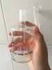 vendita all'ingrosso US Dab tazze bong tascabile in vetro Mini gorgogliatore raccoglitore di cenere in vetro Percolatore in linea Olio per pipa ad acqua