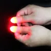 Luci luminose per dita Close Up Pollice Dita Trucco Luce magica Bagliore LED Lampada per dita Giocattoli 500 pezzi IC658