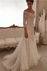 Abiti da sposa popolari in stile occidentale Scollo a V Maniche lunghe a 3/4 Abiti da sposa Illusion Sweep Train Pizzo e tulle Abito da sposa su misura