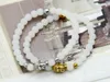 Großhandel 12 Stück Perlen aus weißen Steinperlen Buddha-Armbänder in Gold- und Silberfarbe, wirklich feiner, preiswerter Schmuck