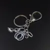 Von 50 Grautönen inspirierter Schlüsselanhänger aus Silber mit fünfzig Maskenball-Masken-Handschellen-Schlüsselanhänger