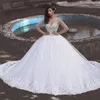 Stunning Crystals Wedding Dress Ball Gown Sheer Jewel Neckline Long Sleeves Beaded Top Tulle Bridal Gowns Lace Appliques Hem