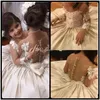 2017 Robes De Filles De Fleur Pour Les Mariages Illusion Cou Manches Longues En Dentelle Appliques Arc Fête D'anniversaire Enfants Communion Fille Pageant Robes