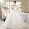 Abiti da sposa con collo alto scintillante Abiti da sposa Principessa Maniche ad aletta trasparenti Cristalli Applicazioni in pizzo Abiti da sposa con corsetto in tulle con paillettes