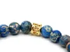 New Design High Grade Jewelry Wholesale 8mm Blue Sea Sediment Stone Bead with Bronze Gold and Silver Skull Bracelet