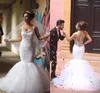 Hot Sale Arabic Wedding Dresses Mermaid Style Crystals Neckline Beaded Lace Appliques See Through Illusion Back Trumpet Tulle Bridal Gowns