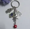 50 Pçs Moda Chaveiro DIY 25mm Chaveiro Turquia Blue Eye Evil Cabala Fatima Hamsa Hand Bell Charms Chaveiro Bolsa Decorativa Presente 185J