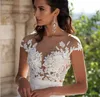 Dresses Chiffon Ivory Wedding Gown Jewel Neck Capped SLeeve Iullsion Back Covered Bottons Elegant Sweep Train Long Gown Chamring WOnderful