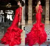 エレガントな赤いレースのウエディングのドレス2017セクシーなオープンバック長袖ティアードイブニングガウンマーメイドの床の長さのフォーマルなページェントのドレス