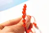 Hand catenary, pure manual weaving red knot + Hong Kong garden red agate beads bracelet.