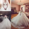 2020 Nya moderna sexiga arabiska långa ärmar En linje Bröllopsklänningar Illusion Lace Appliques Crystal Beaded Tulle Plus Size Formella Brudklänningar