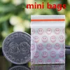 Red Smile Mini Miniatura Zip Lock Grip Bolsas de embalaje de plástico Alimentos Dulces Joyería Resellable Grueso PE Autosellado Paquete pequeño Almacenamiento Regalo