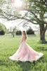 2016 Vendita calda Blush Pink Abito da sposa Sexy Sheer Bling Pearls Applique in pizzo Jewel Neck A Line Backless Country Abiti da sposa Chapel Train