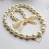 Koreanska Pearl Necklace Armband Set för barn Barnflickor Överdrivna Big Pärlor Smycken Stetsar Vit Färg Barngåvor Partihandel