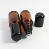 Tjockaste 768pcs / parti 10ml 1 / 3oz Amber glasrulle på flaska Essentiell olja Tom aromaterapi parfymflaska + metallrulle svart hållare