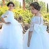 White Ball Gown Flower Girl Dresses For Wedding With Bow On Back Tulle Floor Length Girls Pageant Gowns Lace Short Sleeves Kids Dress