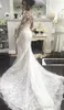 2020 Arabiska lyxiga bröllopsklänningar sjöjungfrun spets pärla pärlor illusion långa ärmar övervakar brudbröllopsklänningar klänning avtagbart tåg