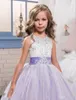 2017 Tutu Viola Natale Flower Girl Abiti Sash Perline Appliques Arco Abiti da sposa carini Hollow Back Ragazze Abito da spettacolo per matrimoni