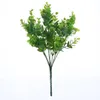 Konstgjord buske med stammar i grön faux plast eukalyptus lämnar buskar falska simulering grönska växter pack av 10
