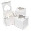Envío gratis 300 piezas 3 pulgadas blanco brillante en forma de corazón ventana cajas de cupcakes cajas de dulces favores boda fiesta mesa ajuste suministros