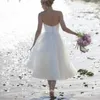 Boho kort straplös sommarstrand bröllopsklänning högkvalitativ te längd oäplösa kvinnor brudklänning plus storlek