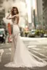 2020 Underbar sexig öppen rygg trumpet bröllopsklänningar rena ärmar full spets applicerad brudklänning se genom sjöjungfru brudklänningar