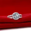 El oro blanco 18K plateó el micro pavimentado Marca plata esterlina NSCD de compromiso de diamantes de halo anillo de corte redondo anillo de las mujeres de lujo de la joyería S925