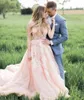 2016 Hot Sell Blush Rosa Bröllopsklänning Sexig Sheer Bling Pearls Lace Applique Juvel Neck En linje Backless Country Bridal Gowns Chapel Train